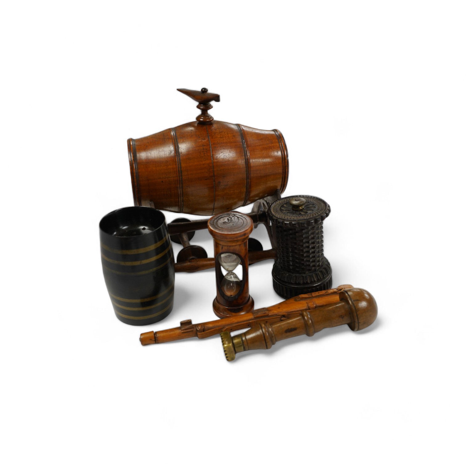 A group of treen to include a spirit barrel with turned wood spigot tap, on wheeled trolley, 17cm long, a pepper grinder, sand timer, etc. (6). Condition - fair